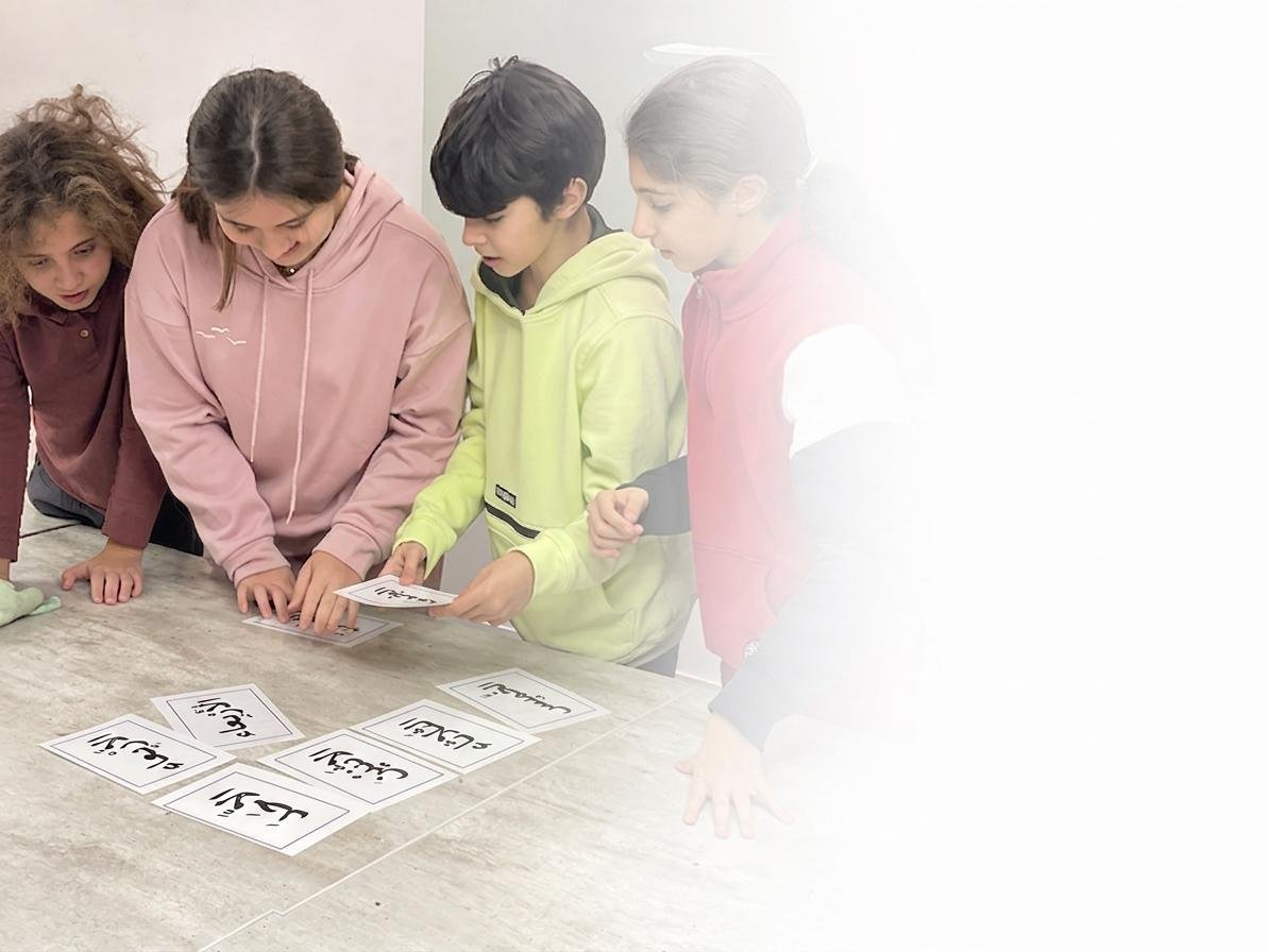 Children learning Arabic with a teacher