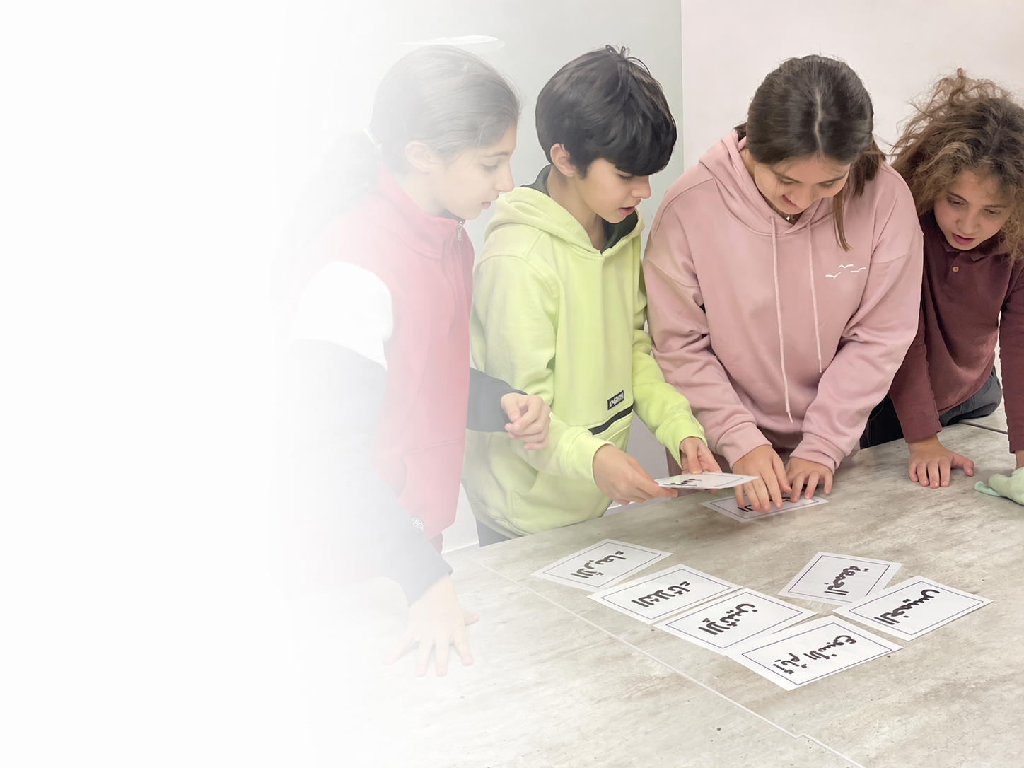 Children learning Arabic with a teacher