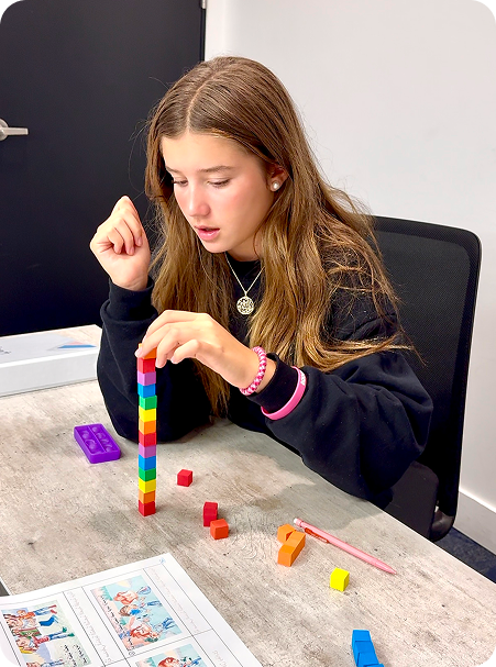 Student building a tower during a Salis lesson